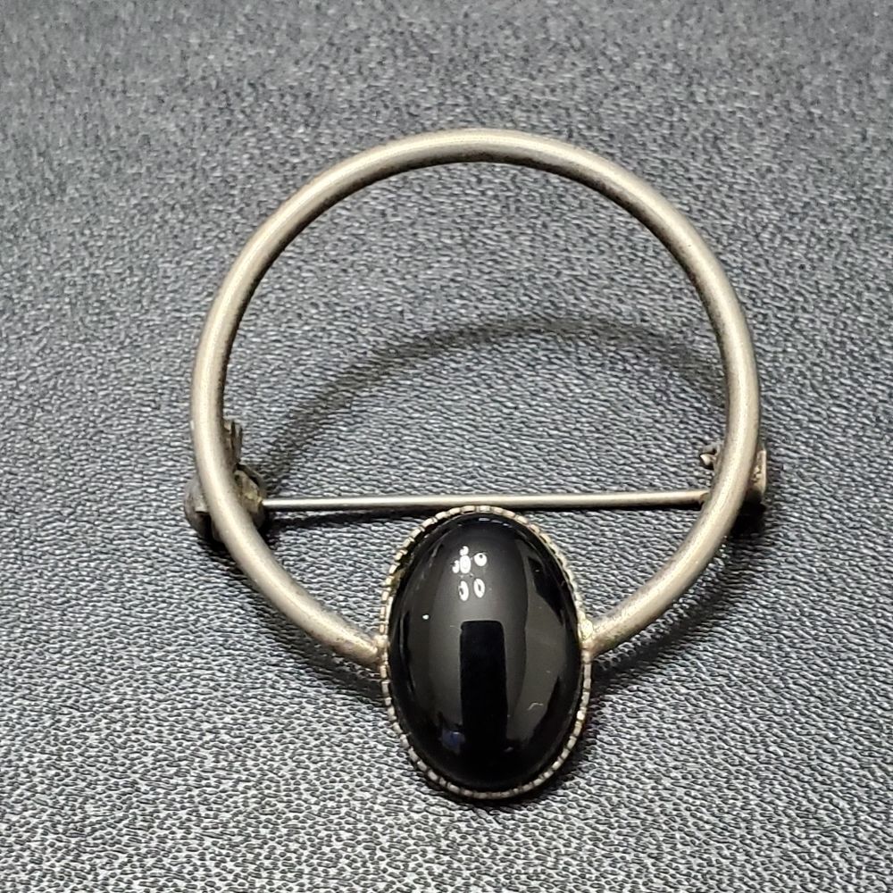 Vintage silver tone circular brooch